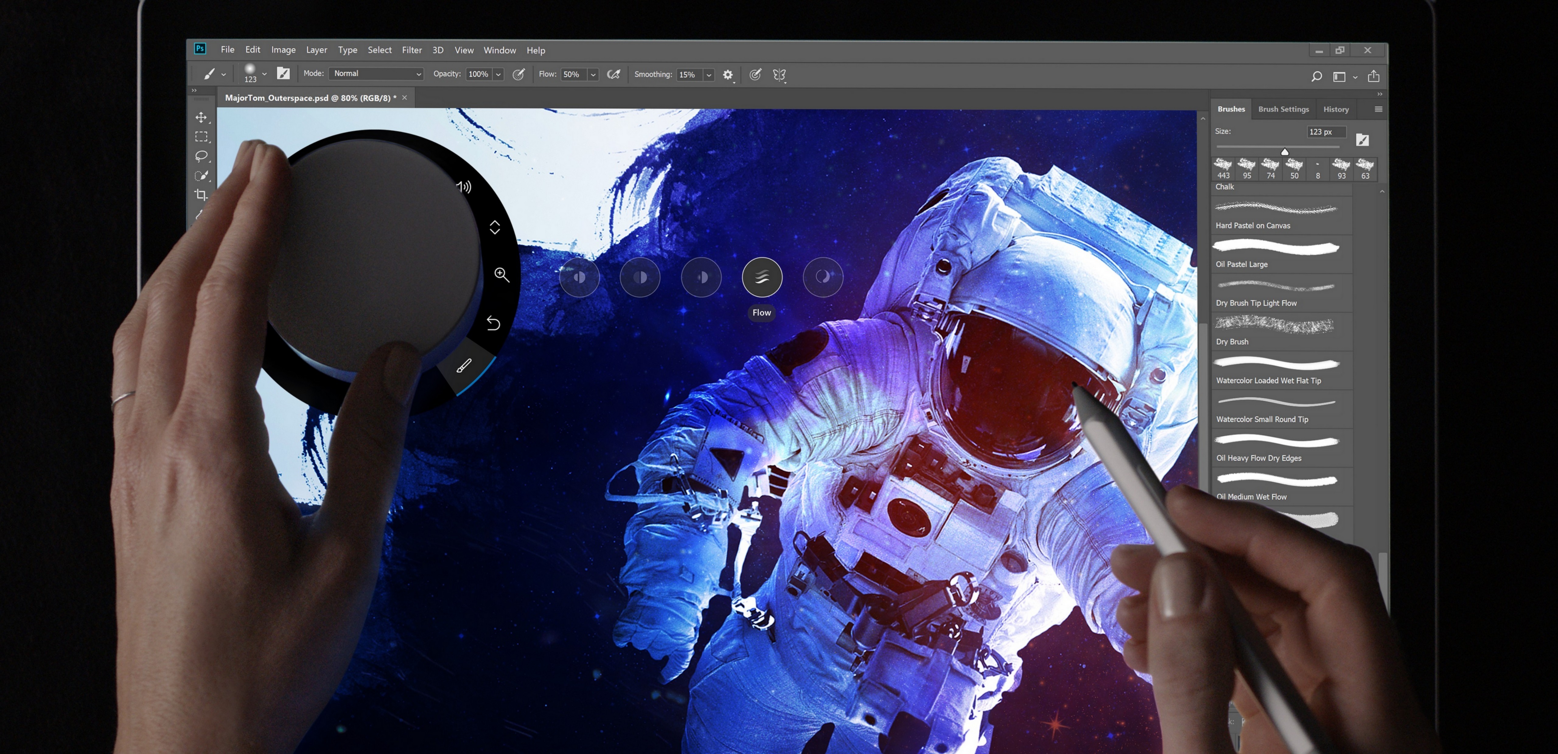 New Photoshop CC features for Surface Dial shown with person's hands holding a Surface Dial and Surface Pen.
