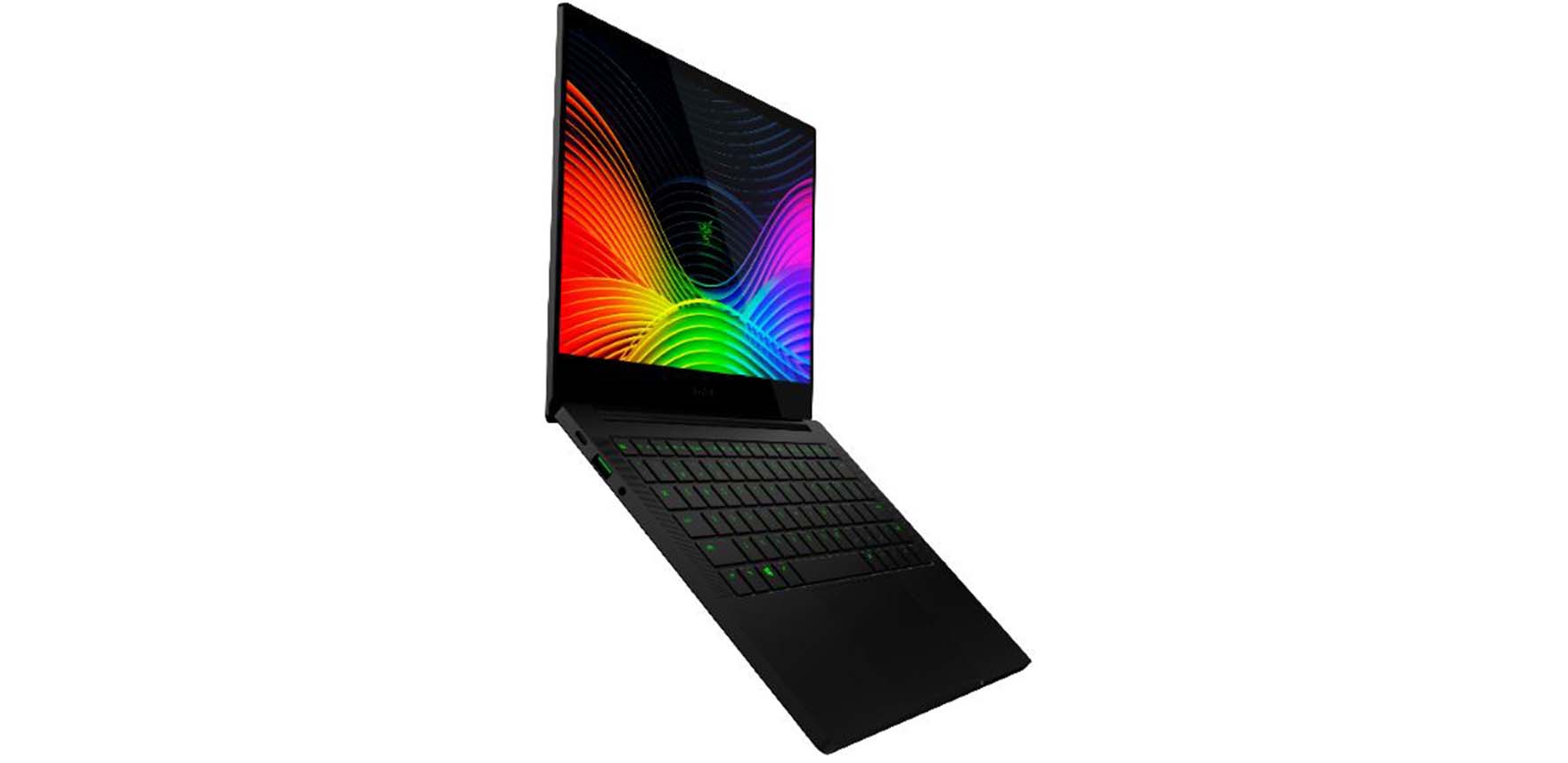 Photo of the Razer Blade Stealth 13, open and facing right with colorful waves on the screen, green backlit keyboard