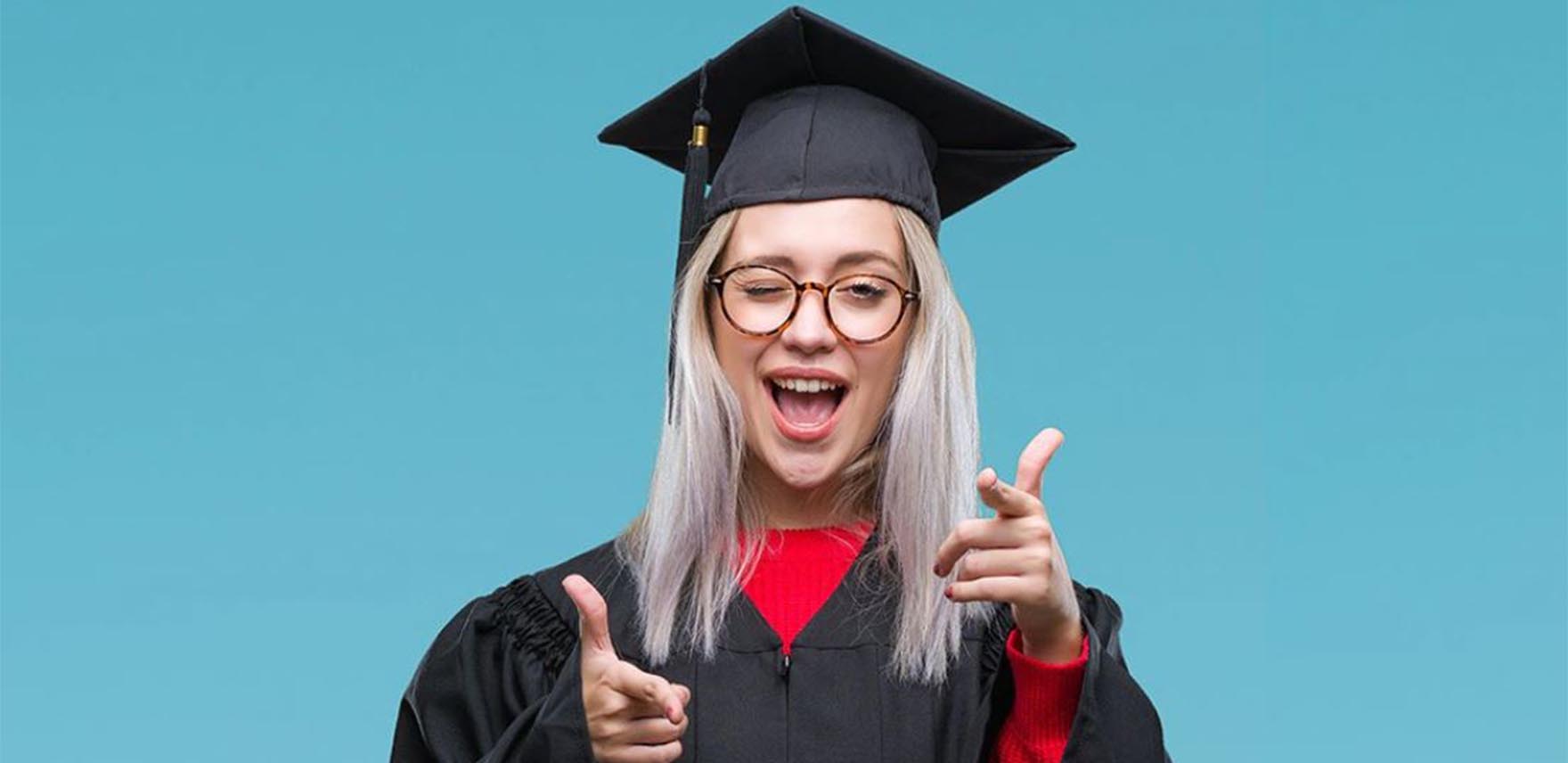 Young woman in graduation cap and gown