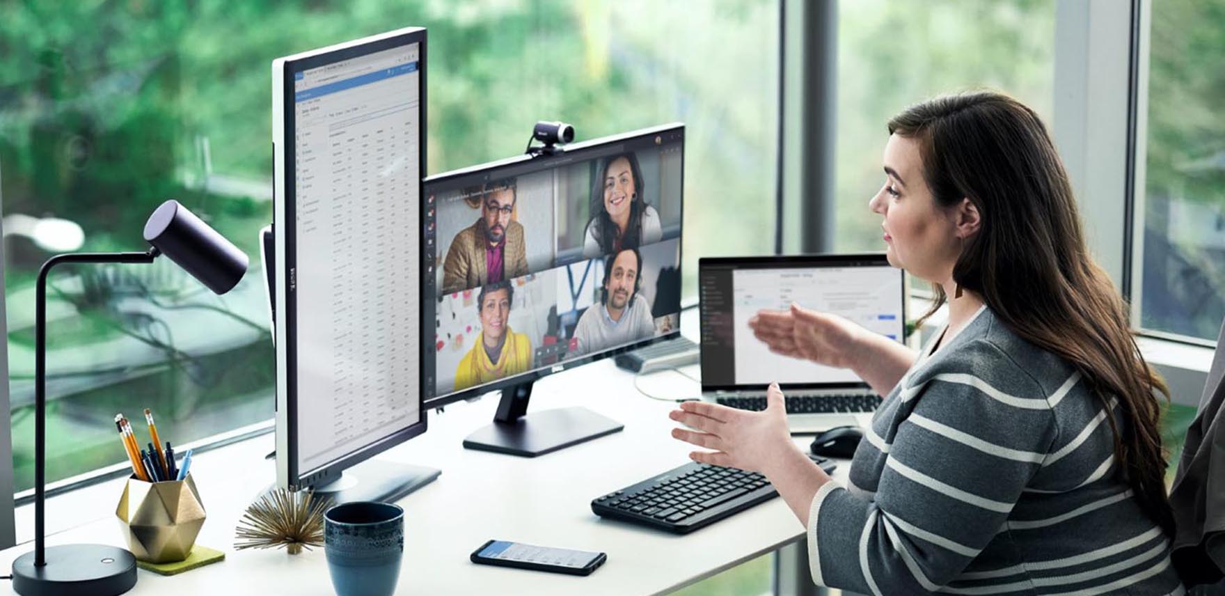 Woman accessing Microsoft 365 on a variety of screens