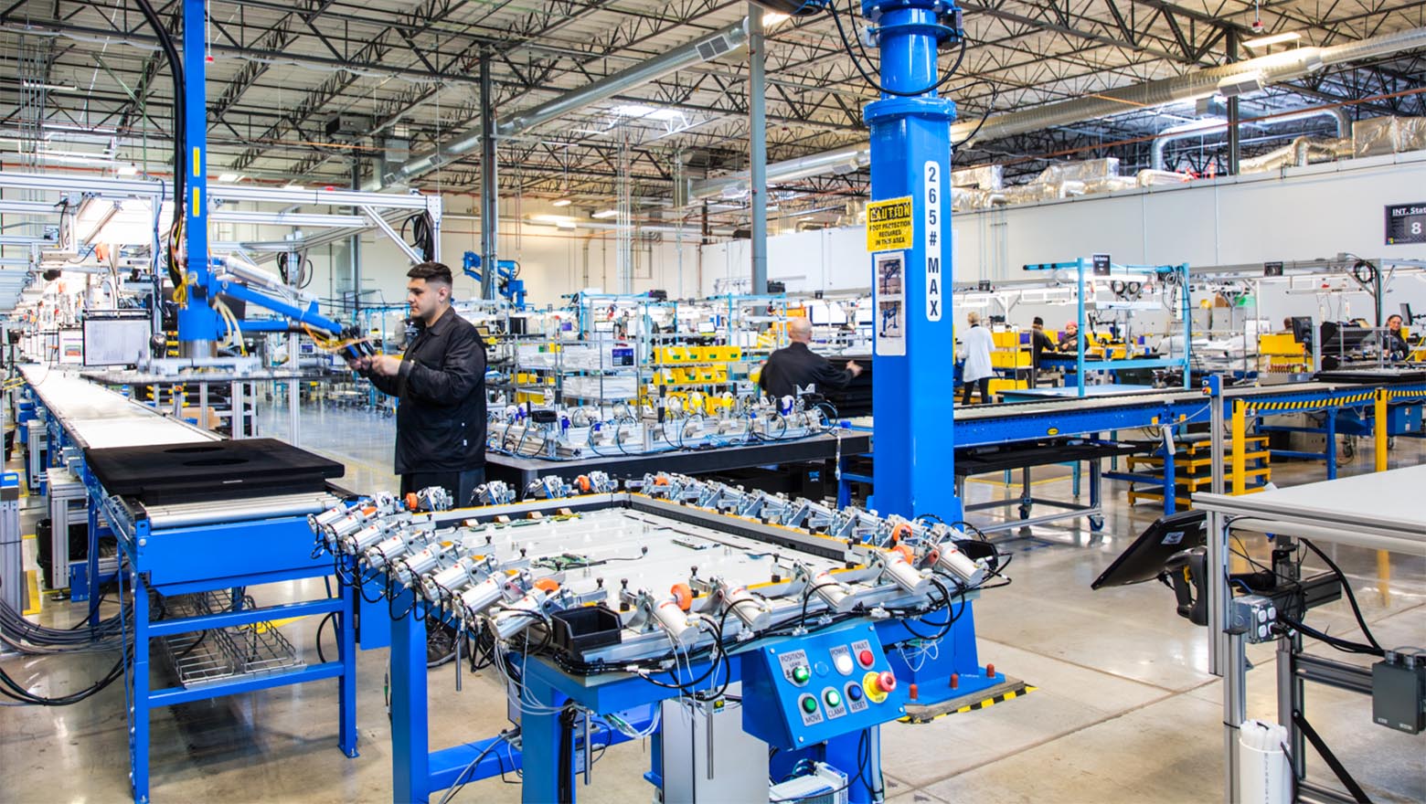 Worker on electronics factory floor
