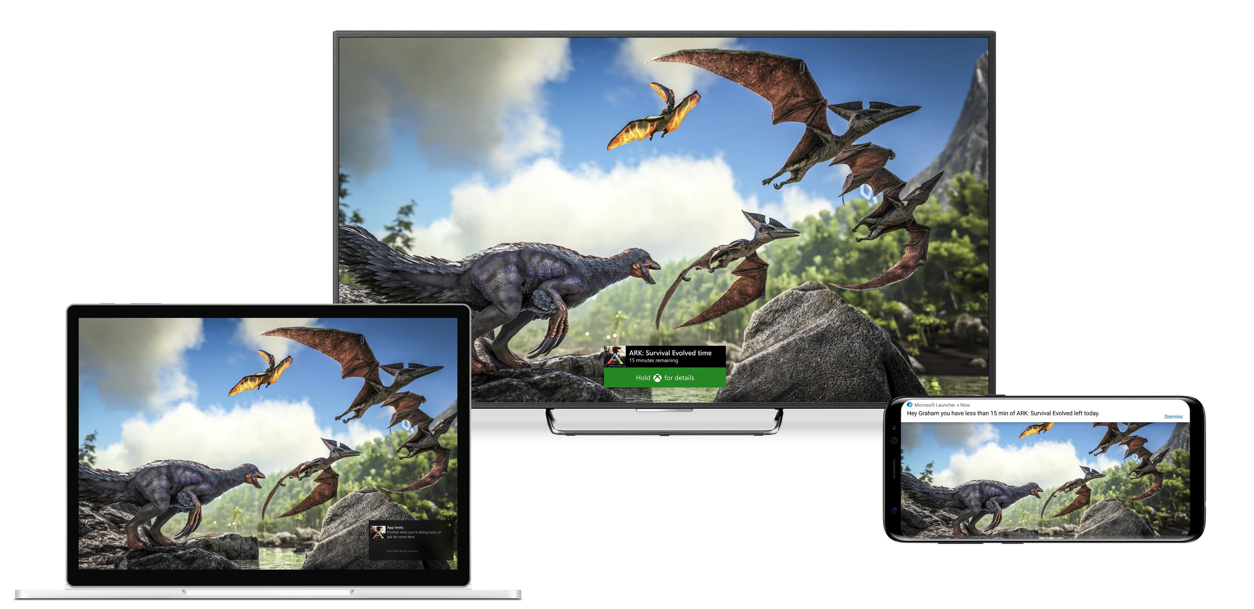 Three screens with same image -- dinosaurs -- on Windows 10 laptop, TV screen and mobile phone