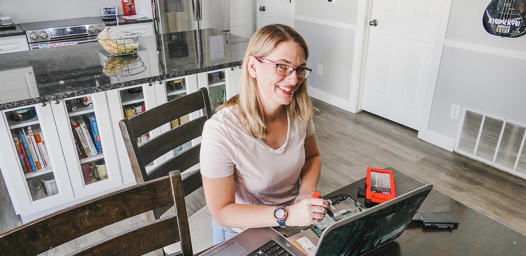 Sarah Kimmel working on a laptop on a table