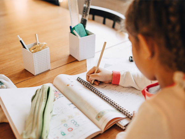 Girl writing on a tablet