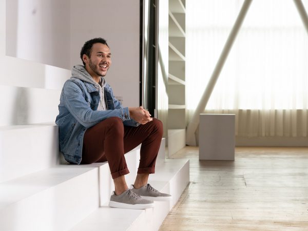 Charles Taylor sits on steps