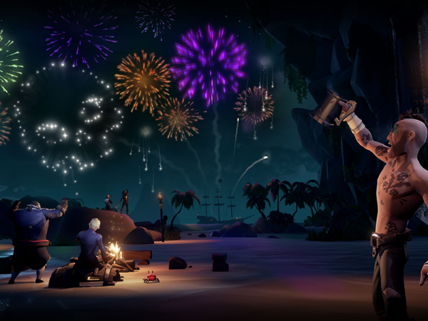 Pirates hoist tankards on the beach under exploding fireworks