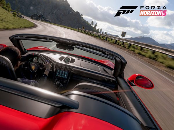 Woman driving up a mountain road in a Forza Horizon auto