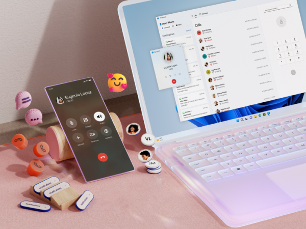 iPhone next to a Windows 11 laptop computer