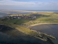 Lindisfarne is a tidal island off the north-east coast of England also known as Holy Island. Northumberland Coast
