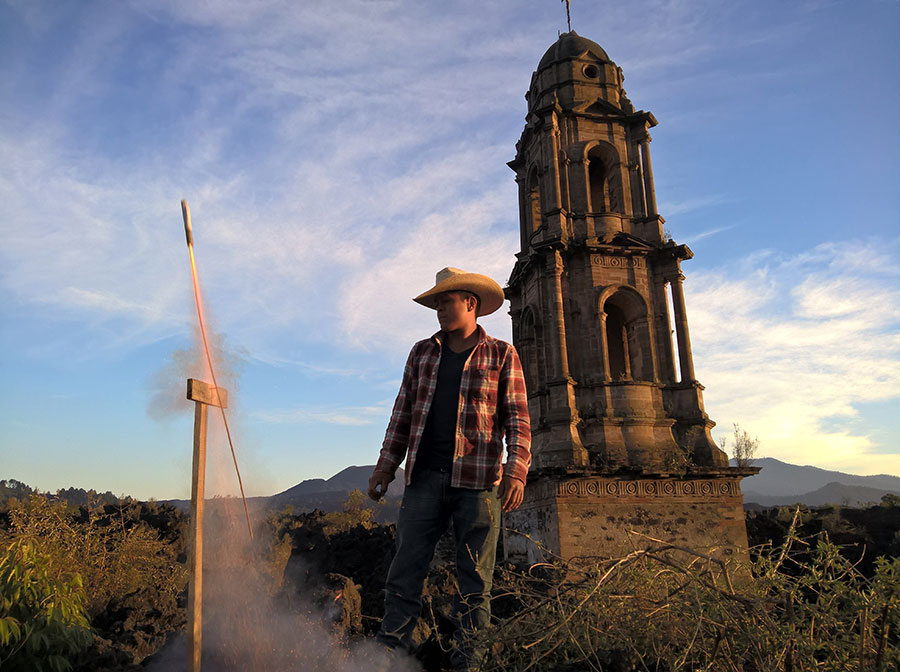 Salvador Perucho fires rockets in front of the remains of San Juan Parangaricutiro church. The oversized fireworks punctuate fiestas, funerals, and even church services throughout rural Mexico. Shot with Lumia 640 XL.