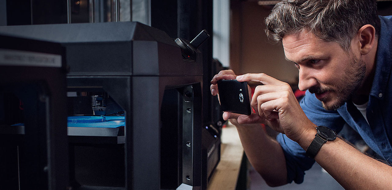 A man taking a photo with a Lumia