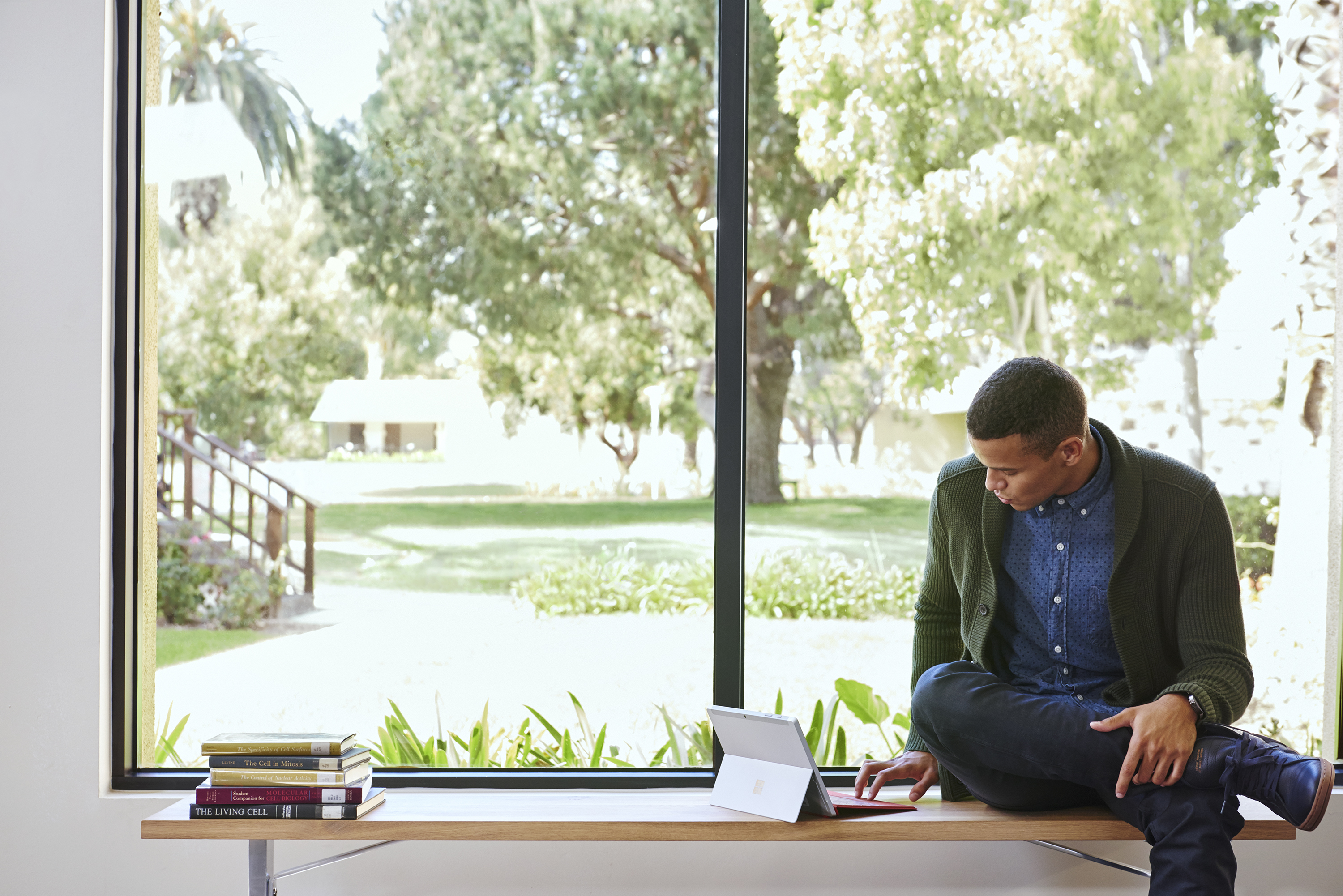 Lifestyle image of man looking at his Surface