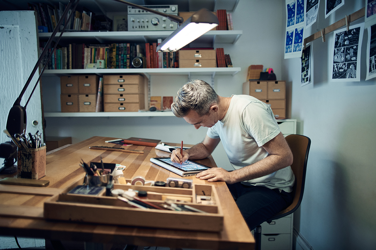 Comic book artist Jordan Crane sketching on his Surface Book.