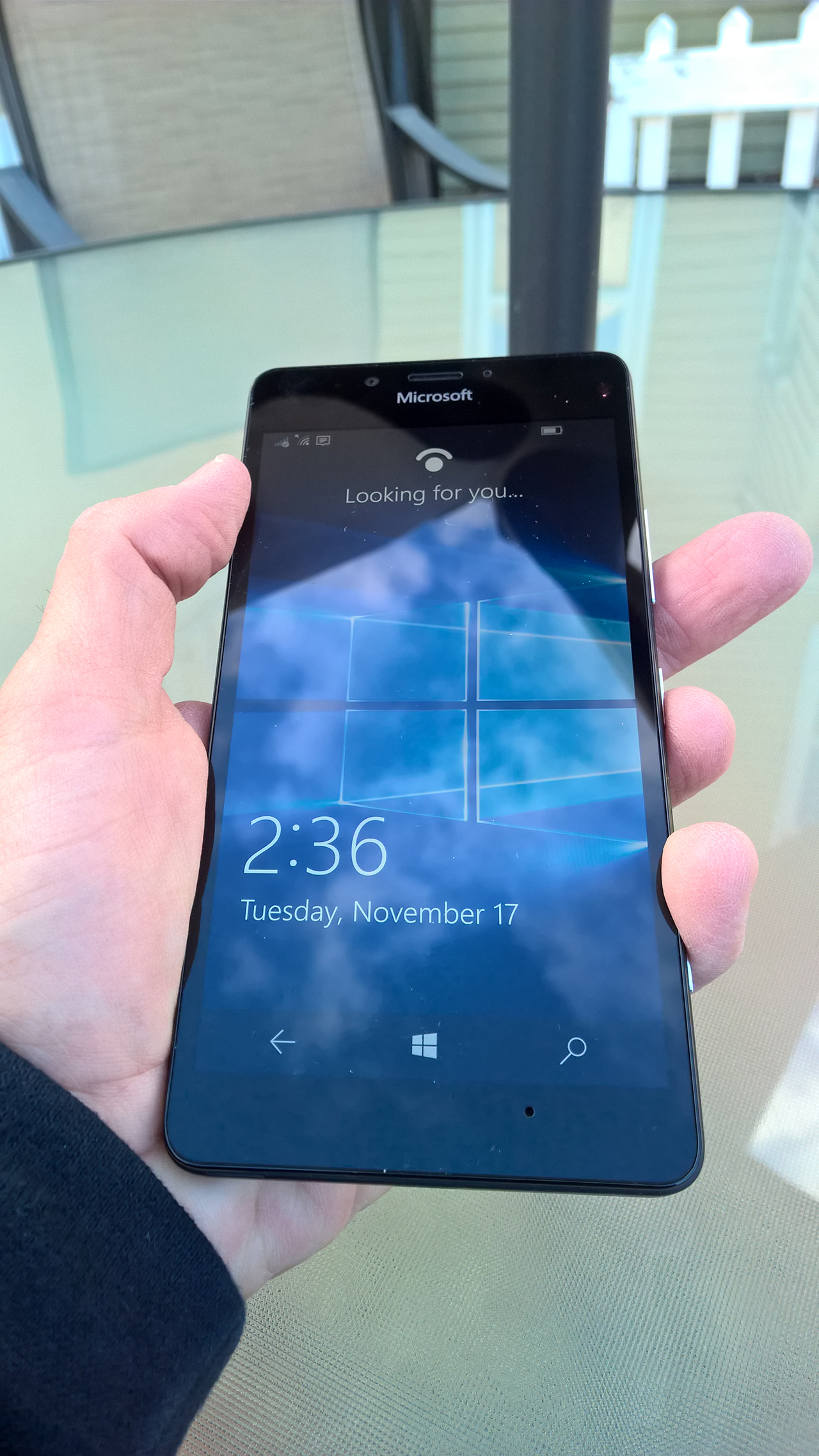 A person holding Lumia 950 in his hand.
