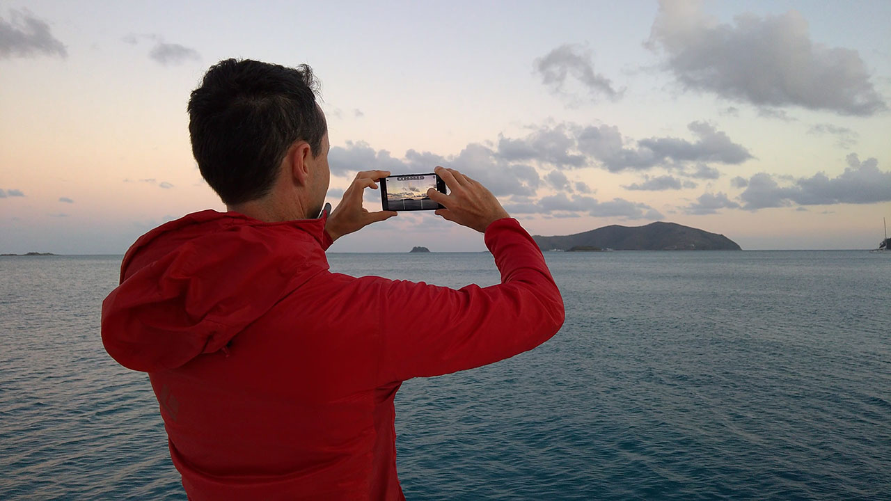 National Geographic photographer Stephen Alvarez taking a picture with Lumia 950 XL.