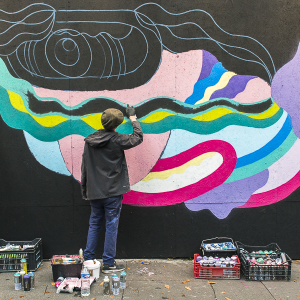 Pablito Zago painting his mural in Paris.