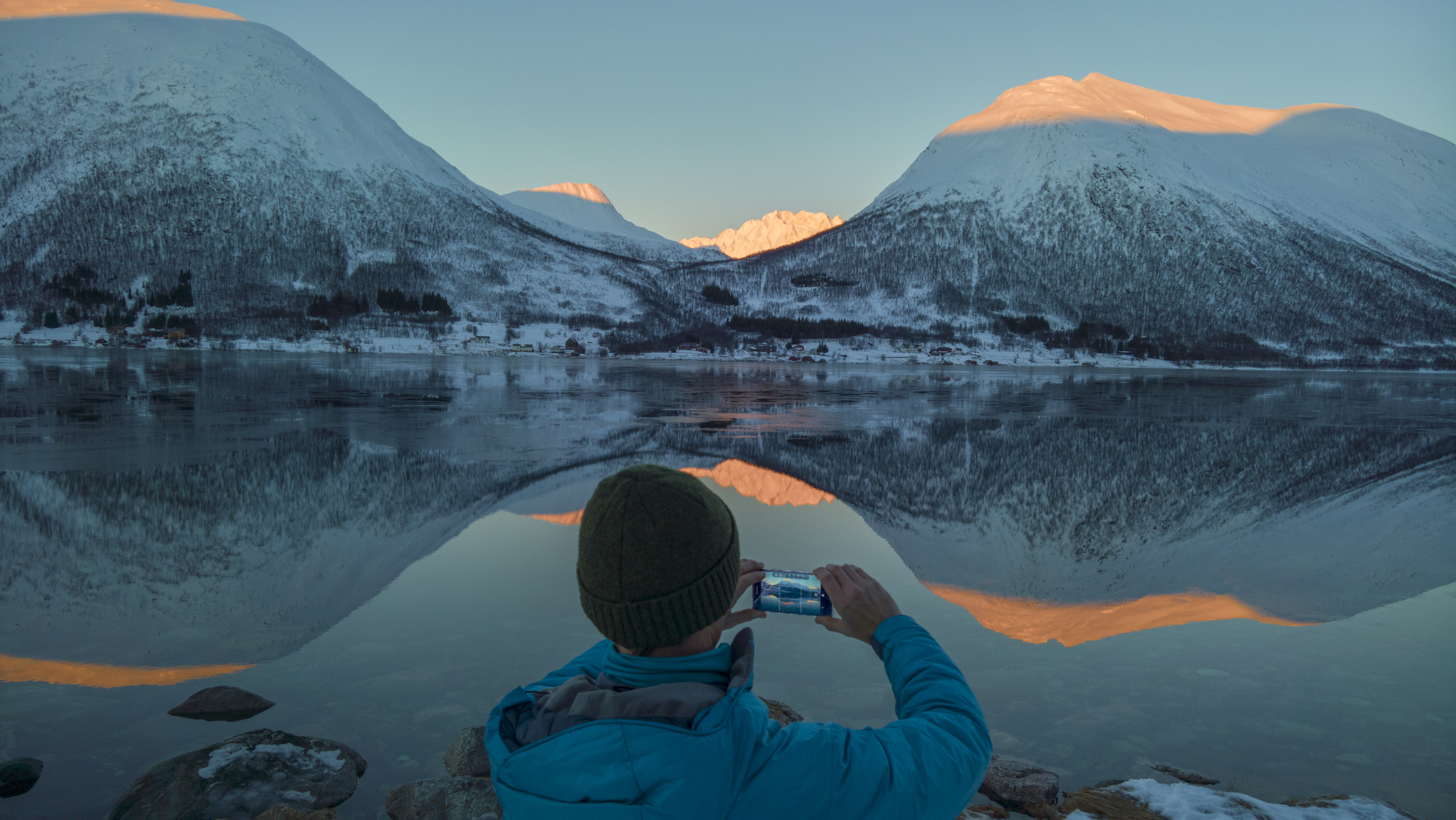 Stephen Alvarez capturing the shadow, light, and water that create dramatic reflections and silhouettes along the Synnov Nordvegen Road near Tromso, Norway.
