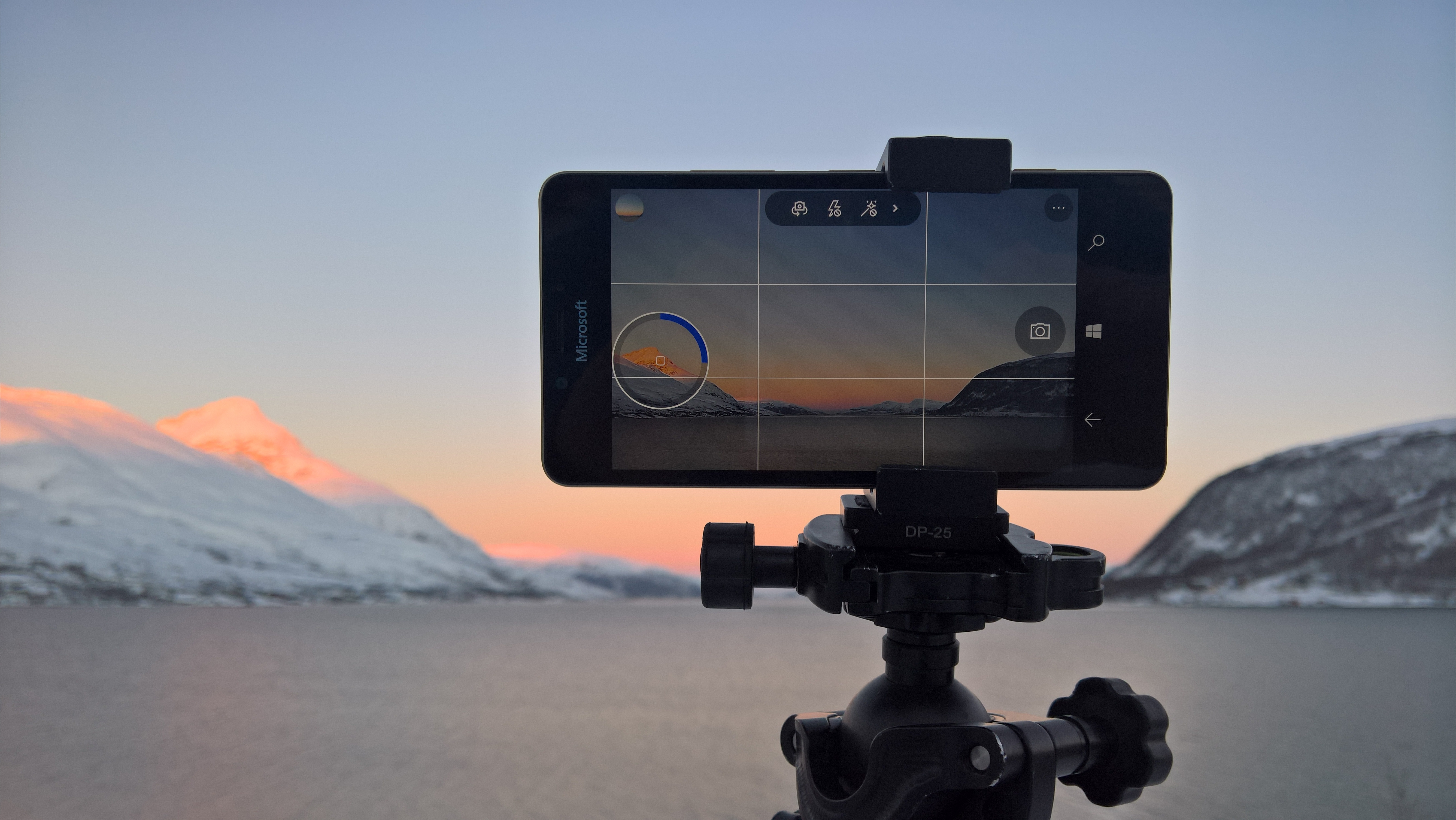 A Lumia 950 smartphone shoots time lapse images of rosy light flooding the sky over Tromso, Norway.