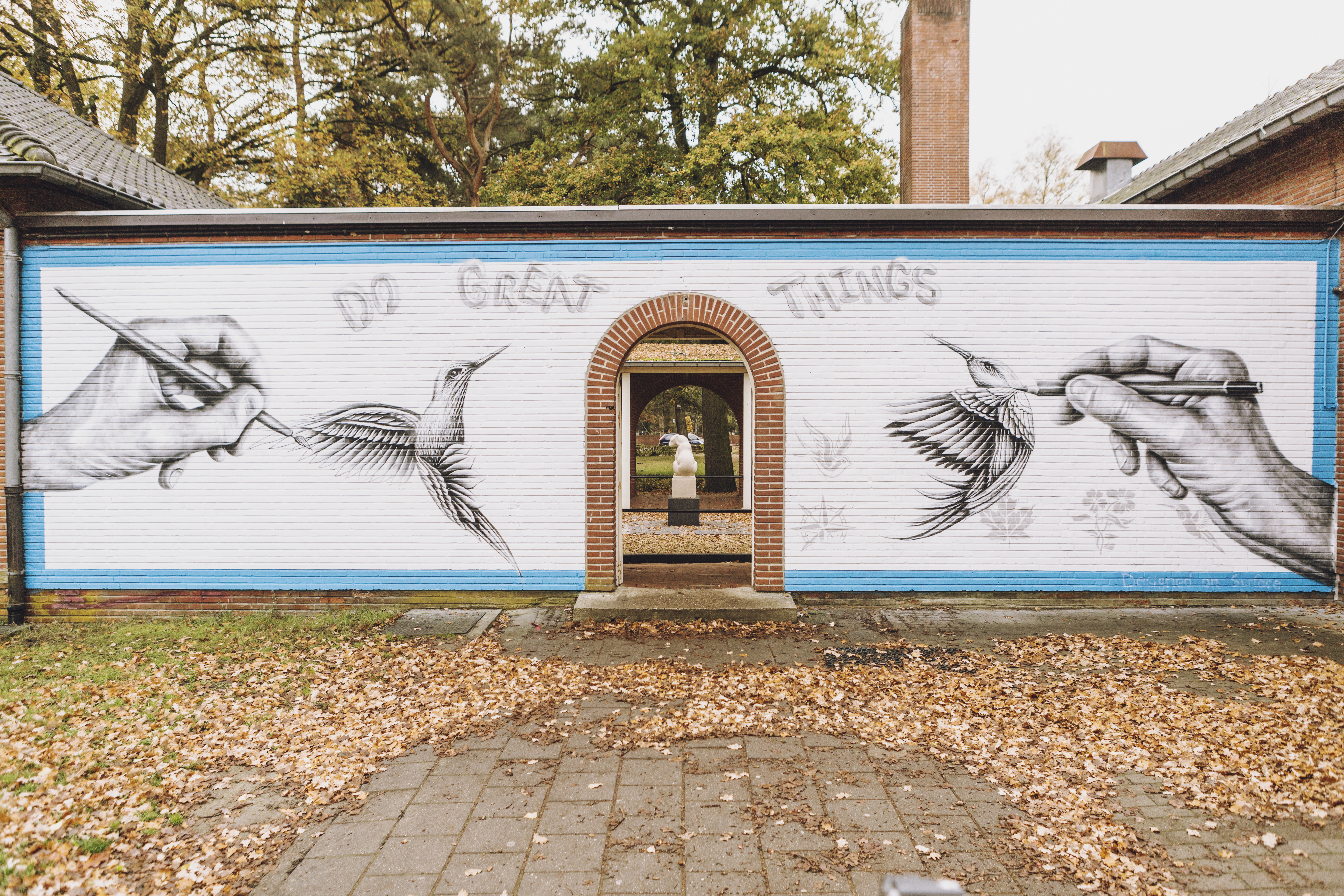 Noir's large scale mural of hands.