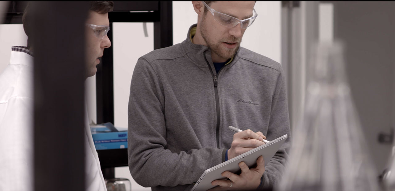Ryan Spoering using his Surface at a lab.