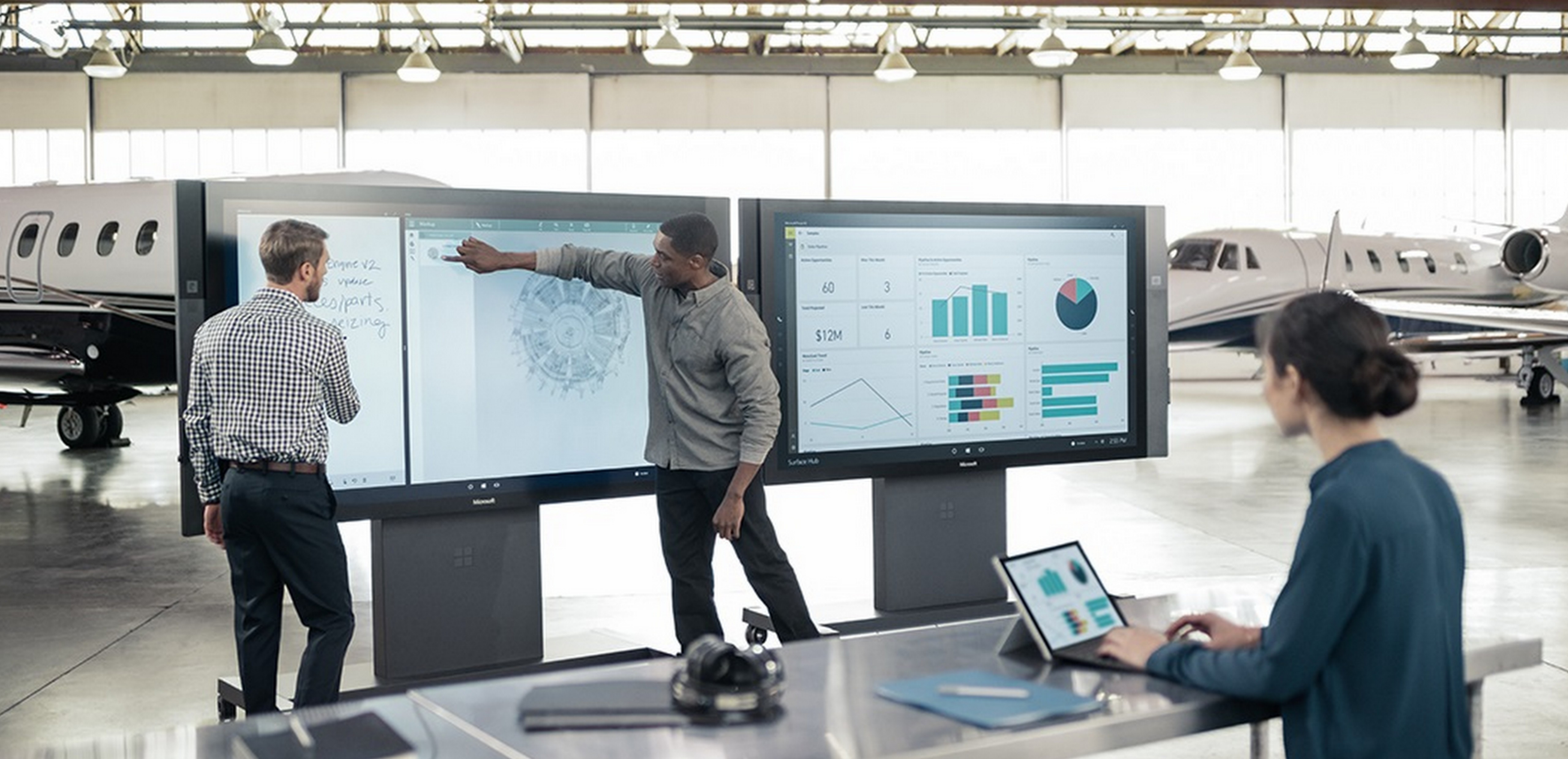 Two men collaborating on Microsoft Surface Hub