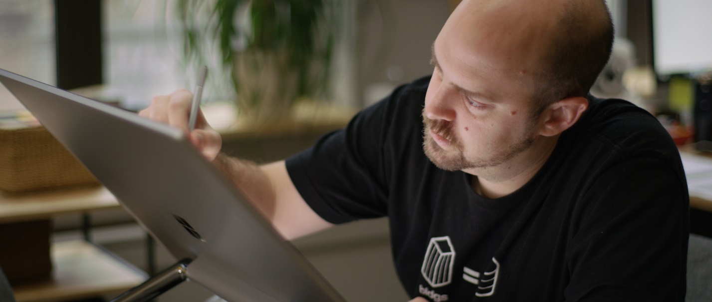 David Fano, Chief Product officer using his Microsoft Surface Studio to design optimized spaces for new members