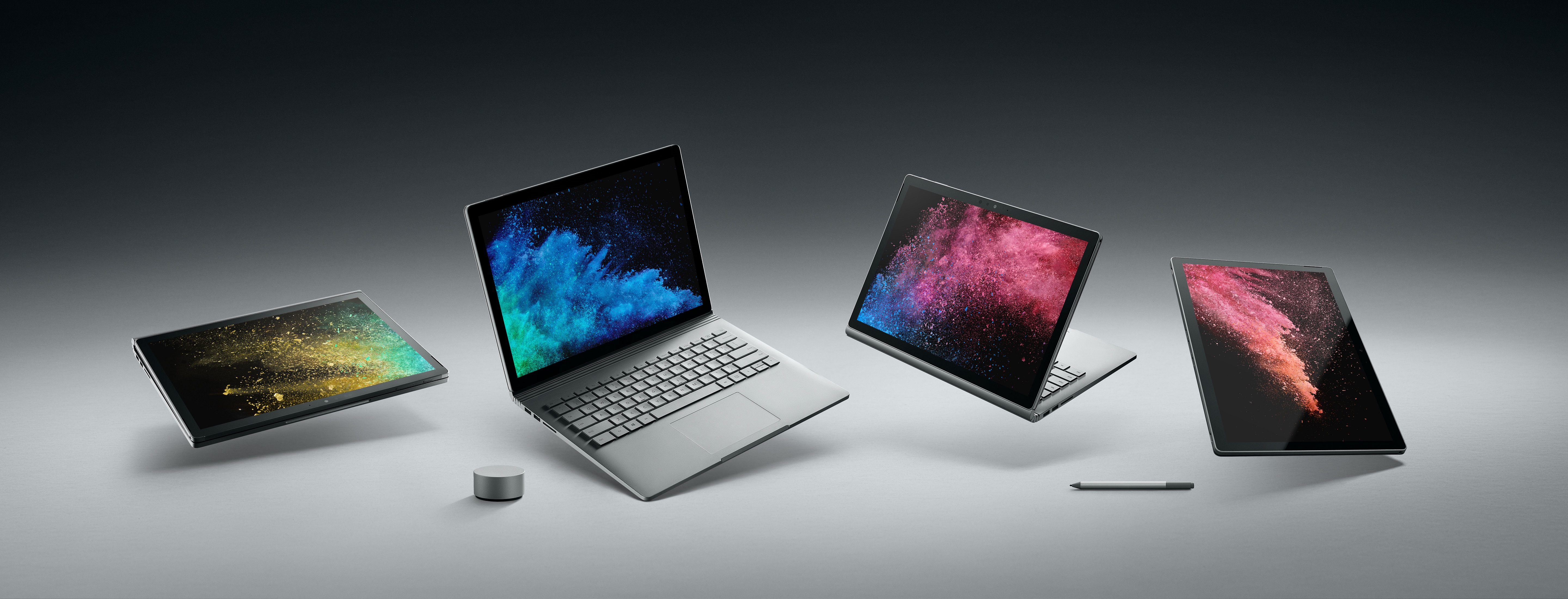 Surface Book 2 shown on a grey background in four different modes.