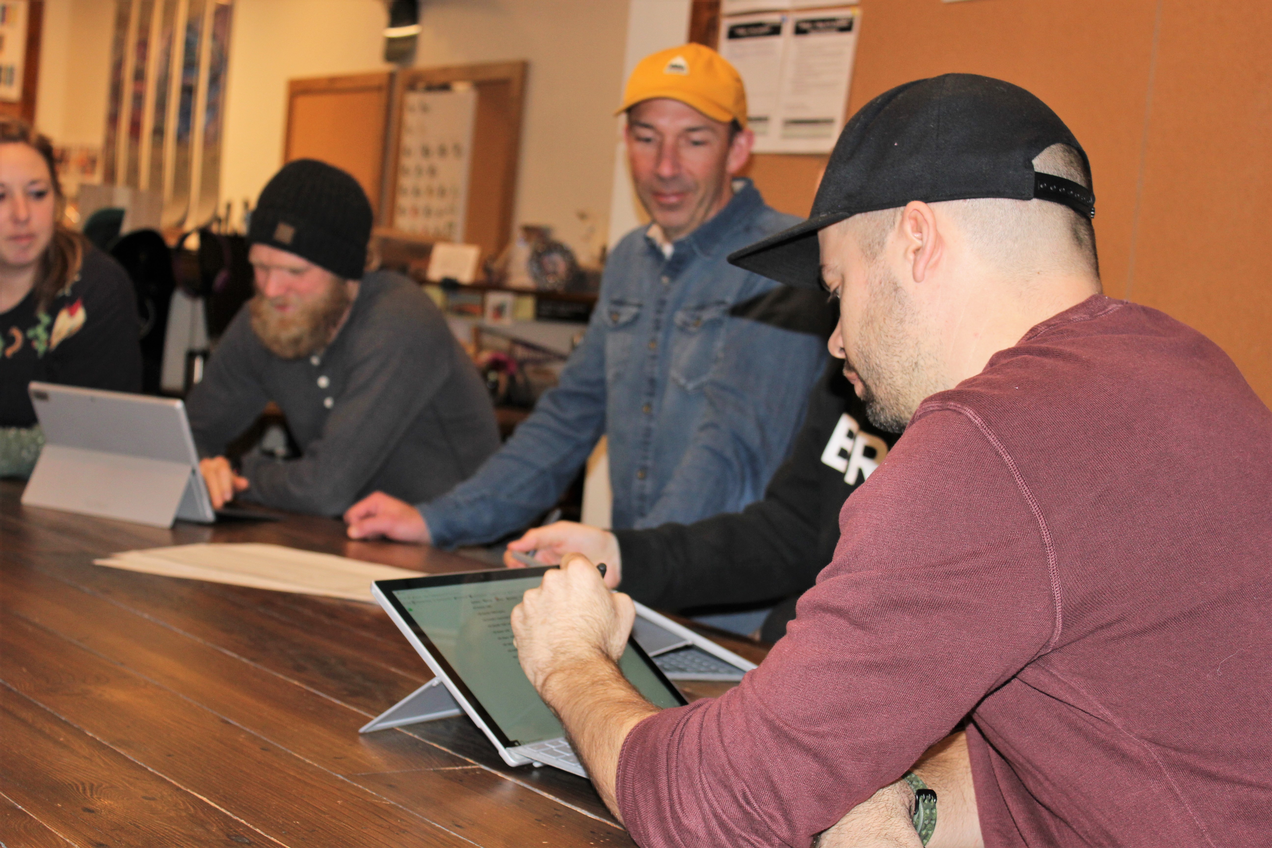 Chris and his team in a creative meeting where ideas are sketched.